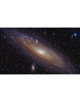 Spiral galaxy space desk pad 40x20 inches with starry black background and glowing core.