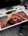 Dramatic 40x20 anime desk mat with fiery red and gold hues, intricate holy sword, and angelic wings, perfect for fans of epic anime artistry