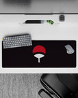 Subtle Uchiha power theme on 32x12 mouse pad featuring fan emblem for Naruto enthusiasts