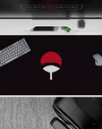 Iconic 40x20 desk pad showcasing Uchiha crest with red and white design for Sharingan legacy fans