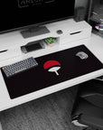 Dark background Uchiha design on 36x16 desk pad ideal for fans of the Sharingan's storied legacy