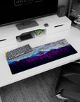 Artistic 32x12 inches mouse pad featuring mountain forest design, glowing watchtower, and purple-blue mountain ranges for a tranquil, peaceful aesthetic.