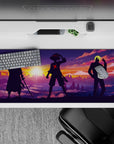 36x16 inches desk pad with Zoro, Luffy, and Sanji from One Piece, capturing their silhouettes in a vibrant sky, embodying unity and strength.