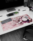 Anime schoolgirl desk pad 36x16 inches, silver hair ribbons, navy pleated skirt, rosy tie amid blossoms.