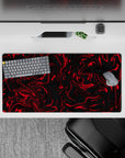 32x16 inches mouse pad with a bold red and black swirl design, featuring fluid, twisting patterns for a modern, edgy, and creative look.