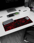 Artistic 32x12 inches mouse pad showcasing a red and black swirl design, with fluid twisting patterns for an intense, creative, and dramatic look.