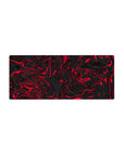 Mouse pad featuring a red and black swirl design, 28x12 inches, with fluid twisting patterns for a bold and modern workspace aesthetic.