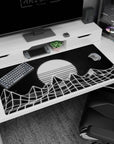 Large 40x20 inches desk pad featuring wireframe mountains and a glowing sun, blending retro-futurism and monochrome aesthetics.