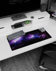 Cosmic design mouse pad with swirling nebula clouds and violet stardust pattern, size 28x12 inches.