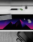 Striking 36x16 desk pad highlights deep pink and purple tones with diagonal neon lines for vibrant flair