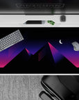Geometric 40x20 desk pad showcases glowing pyramids and diagonal neon lines for immersive retrowave decor