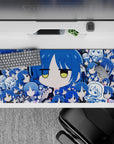 36x16 inches anime girl desk pad in cobalt and sky blues, calm deadpan vibe, smooth surface for fast swipes.