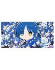 Collage-style anime girl mouse pad 32x16 inches with blue-haired chibi faces, doodle panels, and guitar cameo.