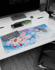 36x16 inches anime desk pad showing a hooded figure cradling pale blue-haired companion beside plush fox spirit.