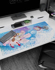 40x20 inches anime desk pad showing a hooded protector holding a pale blue-haired companion beside a fox spirit.