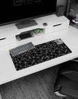 Geometric 28x12 inches mouse pad showcasing bold black-and-white polygon patterns, ideal for a contemporary and stylish workspace.