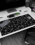Large 40x20 inches abstract polygon desk pad showcasing intricate angular designs in black and white, ideal for a precise and modern workspace.