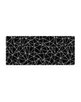 Mouse pad featuring abstract polygon patterns in black and white, 28x12 inches, perfect for adding a sleek, geometric touch to your workspace.