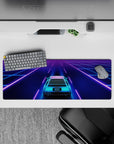 32x12 inches mouse pad featuring a neon car cruising through a city, surrounded by vibrant retro-futuristic colors.