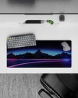 Compact 28x12 mouse pad highlights neon pink and blue tones with a retrofuturistic starry backdrop