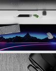 Striking 36x16 desk pad highlights neon pink and blue tones with a starry sky for retrofuturistic vibes