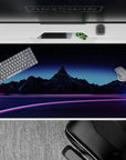 Futuristic 40x20 desk pad showcases neon wireframe mountains and starry sky for immersive retrowave decor