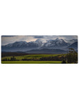 Compact 32x12 inches mouse pad featuring snow-capped peaks and vibrant greenery for a peaceful and dynamic nature touch.