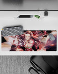 Nezuko demon form mouse pad 32x12 inches, showcasing her mid-transformation with glowing pink eyes and swirling hair.