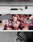 Nezuko in demon form on 36x16 inch desk pad from Demon Slayer, vibrant pink eyes, swirling hair, and surreal lighting.