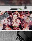 Nezuko Demon Slayer desk pad 40x20 inches featuring her radiant demon form with glowing pink eyes and swirling hair.