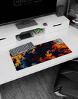 Fractal design mouse pad, 28x12 inches, showcasing swirling orange, navy, and red patterns, ideal for vibrant and creative workspaces.