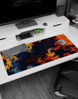 Artistic 36x16 inches fractal desk pad showcasing swirling orange, navy, and red designs, perfect for making a bold, creative statement at your desk.