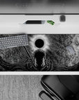 36x16 inches desk pad showcasing Guts in front of the Eclipse, with intricate patterns in the sky and his sword resting on his back, perfect for bringing dark intensity to your workspace.