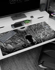 Large 40x20 inches desk pad featuring Guts beneath the Eclipse, with swirling shadows and intricate sky patterns, perfect for fans looking to add dark, epic energy to their workspace.