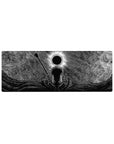 Compact 32x12 inches mouse pad with Guts standing beneath the Eclipse, surrounded by swirling shadows and intricate patterns, perfect for adding dark intensity to smaller desks.