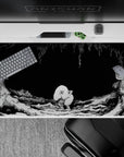 40x20 inches desk pad showcasing the unsettling creature from Berserk, surrounded by dark, twisted textures, capturing a quiet, eerie moment from the series.
