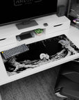 Artistic 36x16 inches desk pad featuring the creature from the abyss in Berserk, ideal for fans seeking dark, moody elegance and minimalist design.