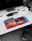 28x12 inches anime mouse pad featuring grinning boy in badge cap holding a shy pink-haired girl's cheeks.