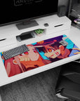 36x16 inches anime mouse pad close-up of grinning boy in dark cap and shy pink-haired girl, cheek-cupping pose.