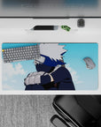 Anime mouse pad 32x16 inches featuring Kakashi Hatake from Naruto, with silver hair and navy tones under a soft blue sky.