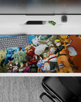 36x16 inches anime desk pad with bold sky colors, Kurama grin, blue flames, and stone textures.