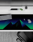 36x16 inches desk pad with neon pyramids and green and blue hues under a crescent moon, perfect for retro-futuristic vibes.