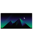 Mouse pad featuring the Midnight Pyramid Glow, 32x16 inches, with sleek neon pyramids and vibrant colors under a crescent moon.