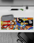 Playful 32x12 mouse pad features Luffy Zoro Nami Sanji and crew for fans of One Piece's camaraderie