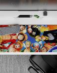 Dynamic 36x16 desk pad highlights Straw Hats' friendship and unity in a fun and colorful tribute