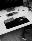Red-eyed dark-haired anime girl glancing over shoulder on 28x12 inches mouse pad, choker and twin blades.