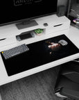 36x16 inches anime girl desk pad showing a dark-haired girl looking back over her shoulder with sly red eyes.