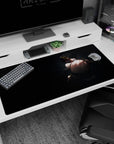 Dark-haired anime girl glancing over her shoulder on desk pad 40x20 inches, choker and slim blades.