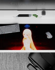 Late-night fantasy desk pad 36x16 inches in black with red embers, neon-blue glow, soft golden highlights.