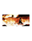 Mouse pad featuring Eren Yeager, 28x12 inches, facing the Colossal Titan in a blazing inferno for a powerful AoT scene.